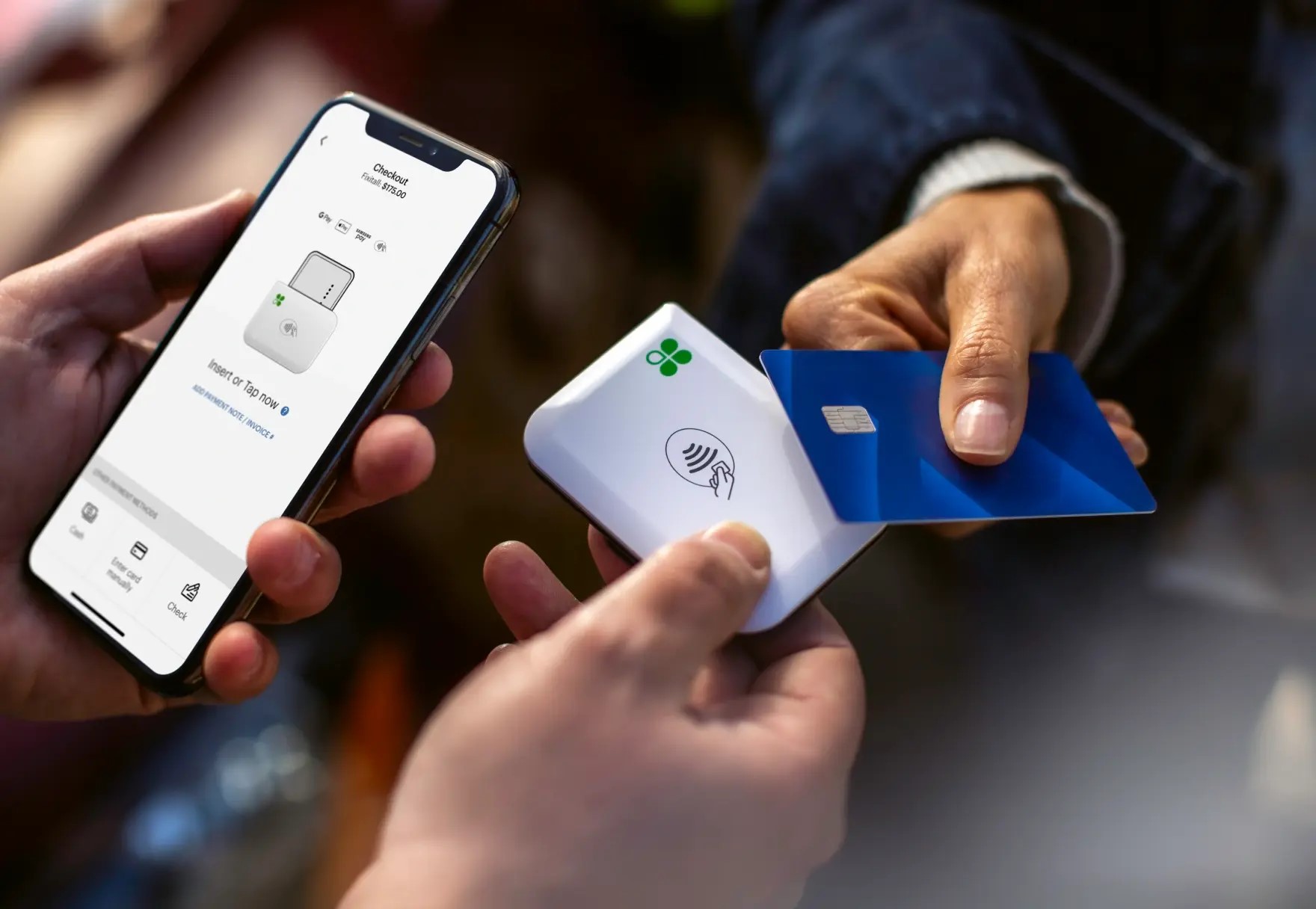 Clover Go card reader used with a smartphone for contactless payment